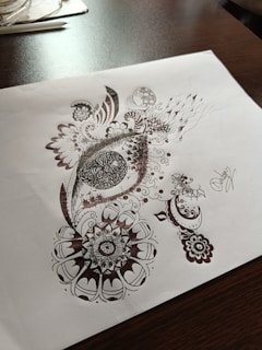 Close-up of detailed hand-drawn illustrations on paper.