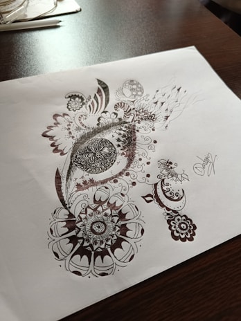 Close-up of detailed hand-drawn illustrations on paper.