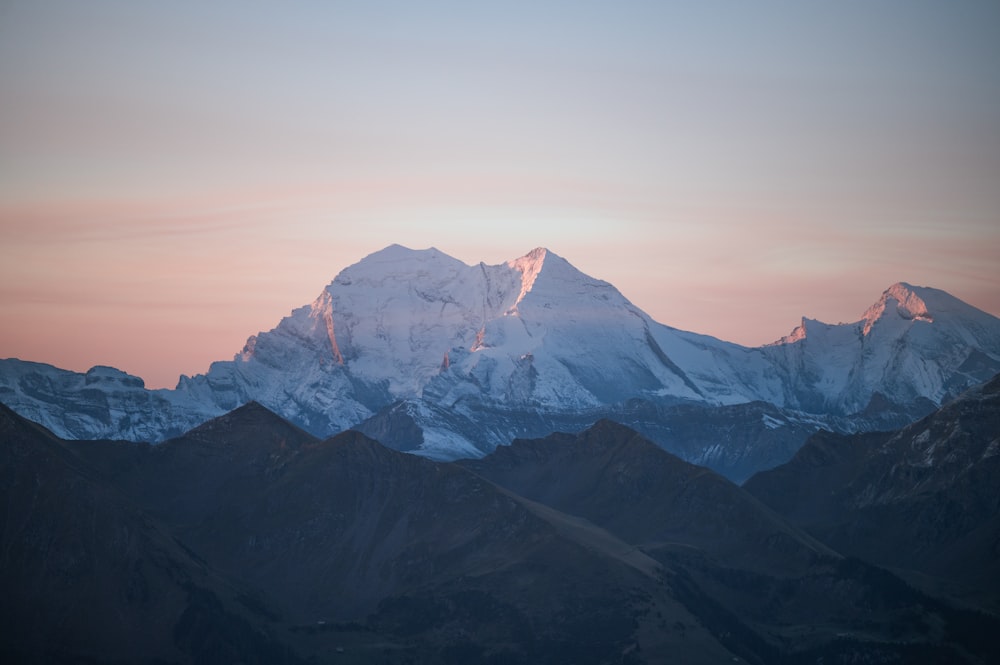 a view of a mountain range at sunset