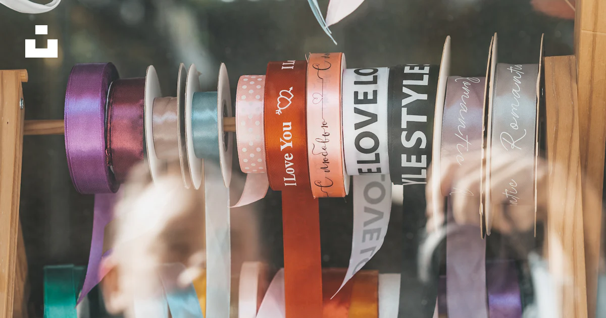 A bunch of ribbons hanging in a window photo – Free Street Image on ...
