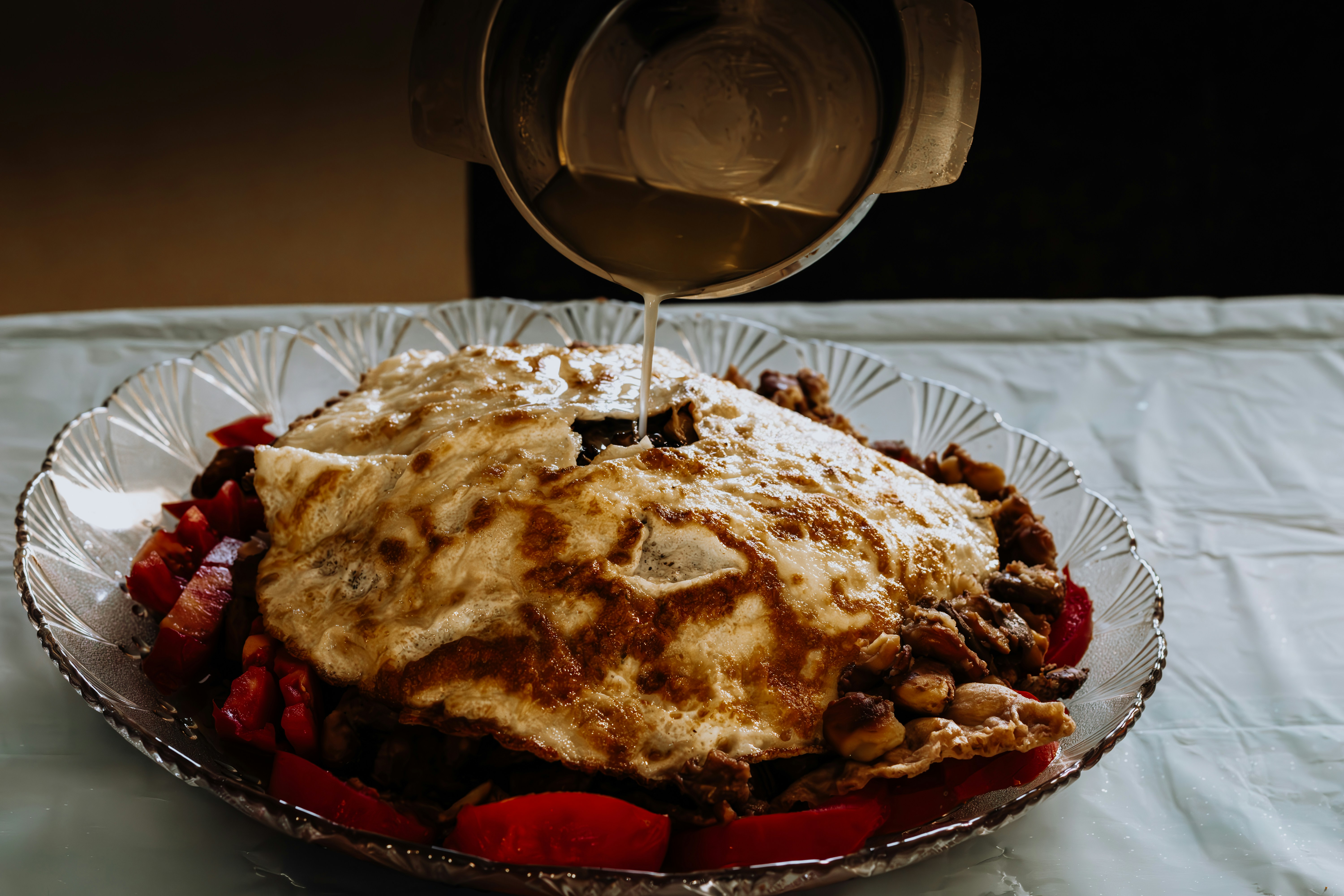 a plate of food with a glass of wine