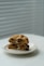 a white plate topped with two cookies on top of a table