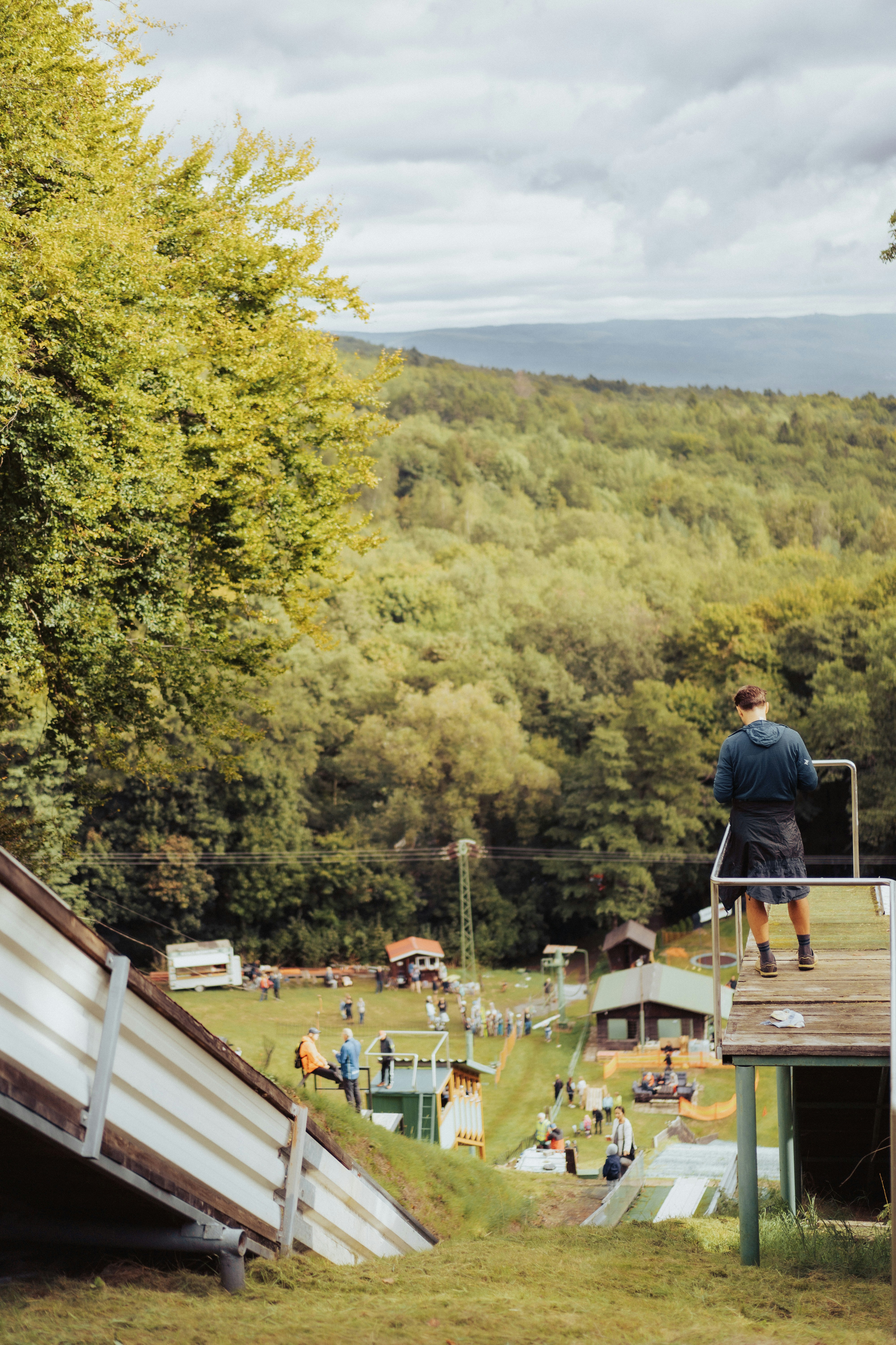 A man standing on top of a wooden ramp photo – Free Springboard Image ...