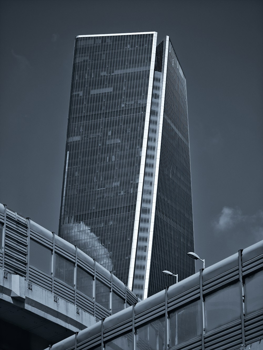 a black and white photo of a tall building