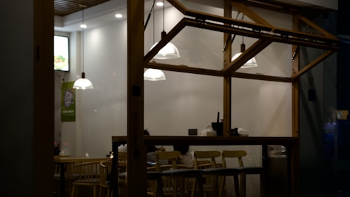 Transformation of a small café interior with warm lighting and minimalist decor.