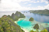 Pristine turquoise waters and coral reefs surrounding the Andaman Islands.