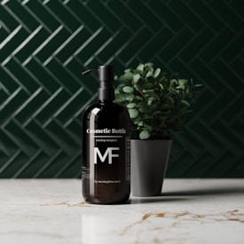 A sleek black cosmetic bottle with a pump sits on a marble countertop. The bottle is labeled with the text 'Cosmetic Bottle' and features the letters 'MF'. It is placed next to a small potted plant with green leaves. The background features a dark green herringbone tile pattern.
