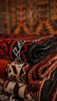 a pile of rugs stacked on top of each other