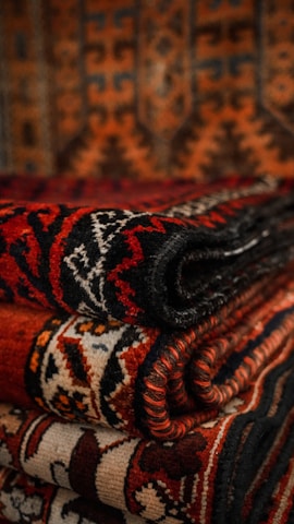 Close-up of traditional African textiles showcasing deep earth tones and geometric designs.