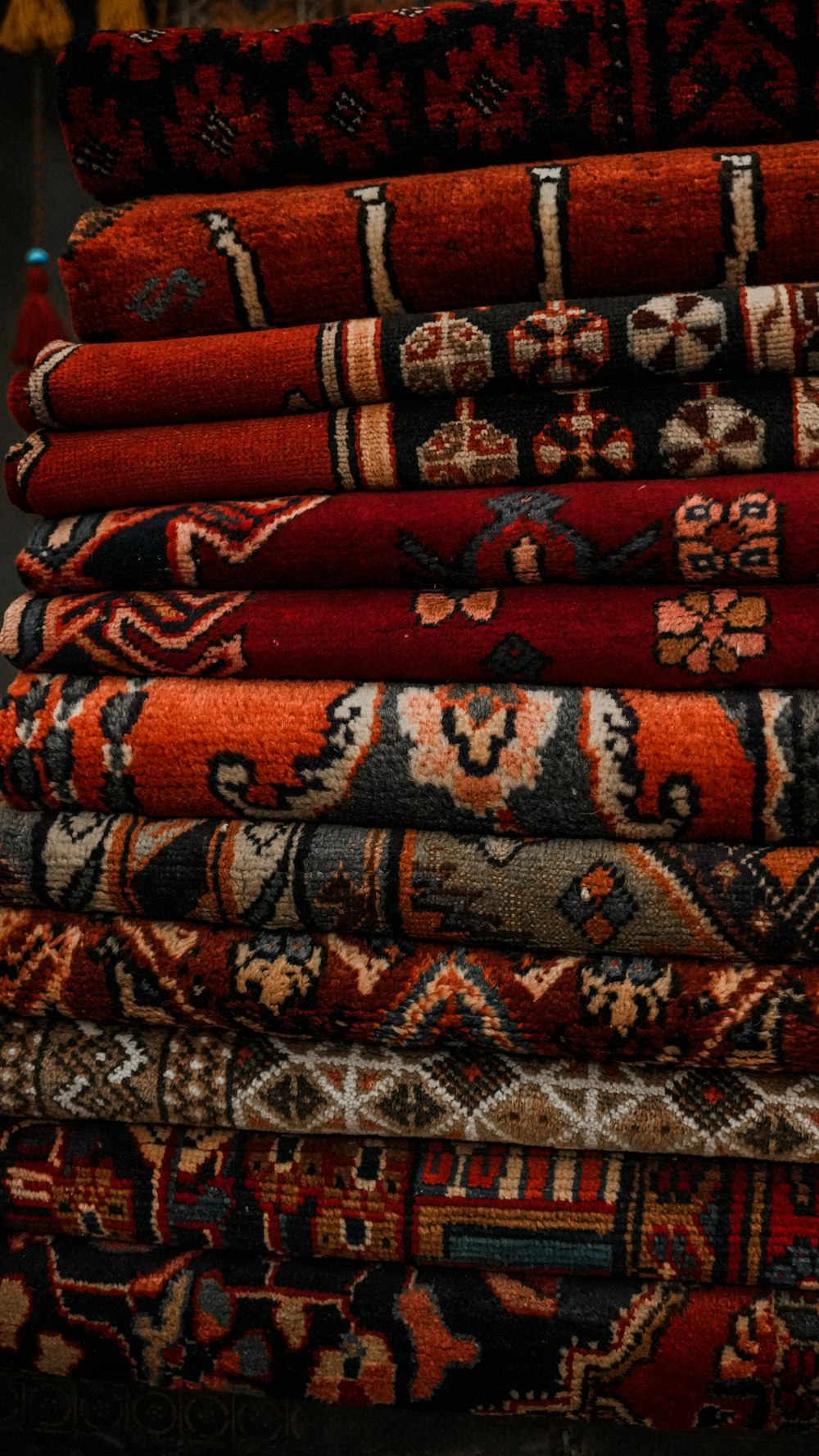 a pile of rugs stacked on top of each other