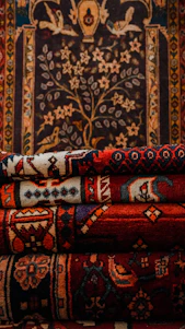 a pile of rugs sitting on top of a rug