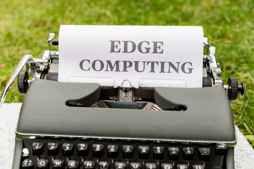 a close up of an old fashioned typewriter with a paper that reads edge computing,