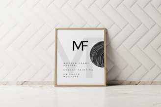 a picture frame sitting on top of a counter next to a wall