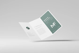 a folded brochure with a green and white design