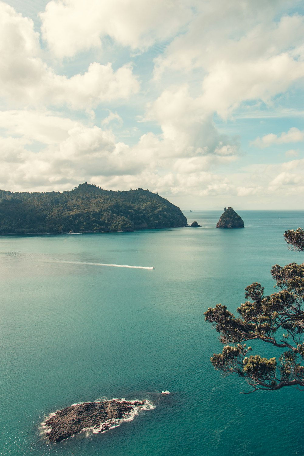 a body of water with a small island in the middle of it