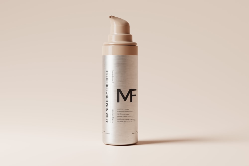 a bottle of mf cosmetics on a beige background