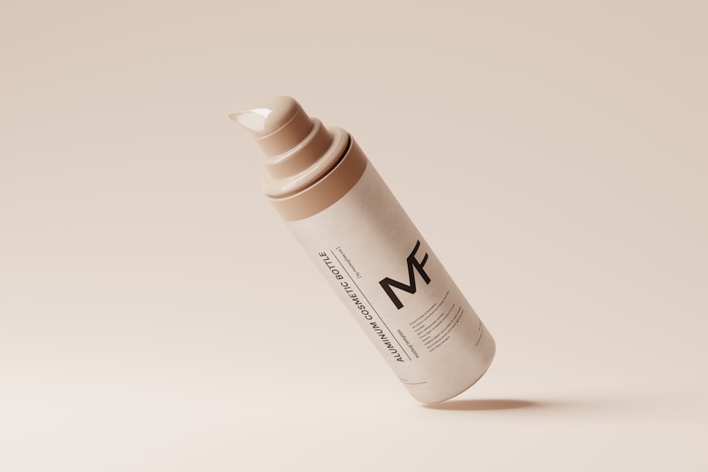 a bottle of n k cosmetics on a white background