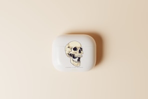 Minimalist white AirPod case with a custom name engraving.