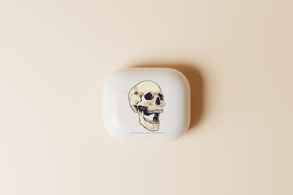 a white case with a picture of a skull on it