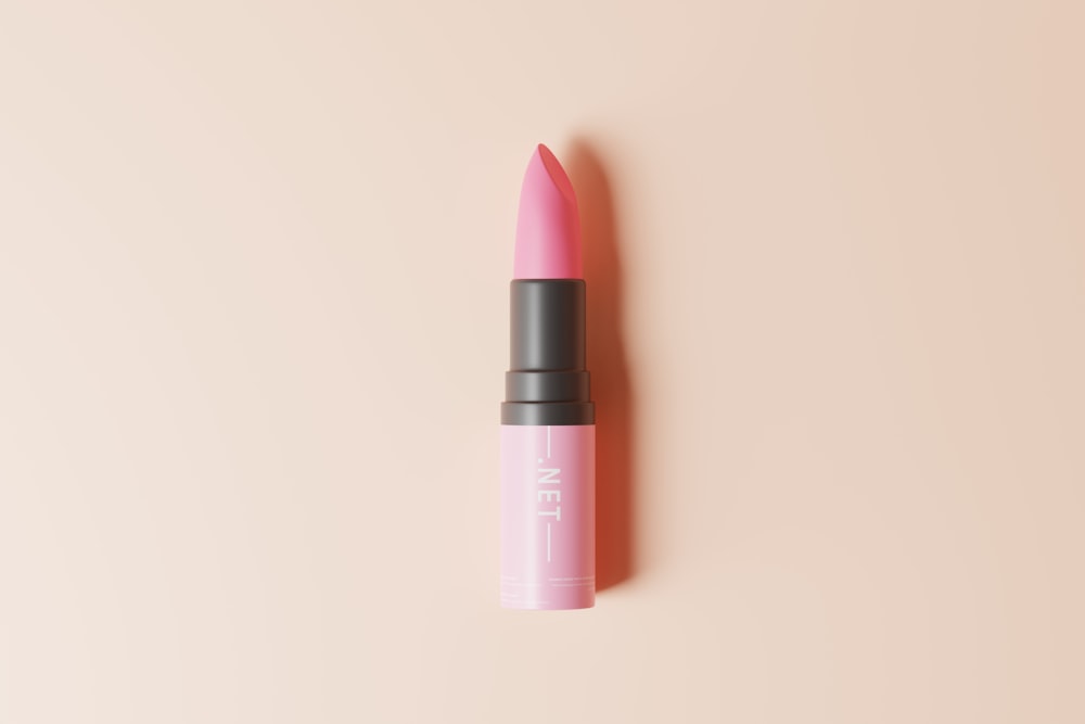 a pink lipstick on a pink background