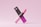 A pink lipstick is positioned in an elegant manner along with its packaging. The lipstick tube is sleek and modern, with a gradient of pink shades transitioning from light at the bottom to a darker hue at the top. The packaging displays the brand logo along with text in a matching pink color scheme. The overall aesthetic is minimalist and chic, set against a light pink background.