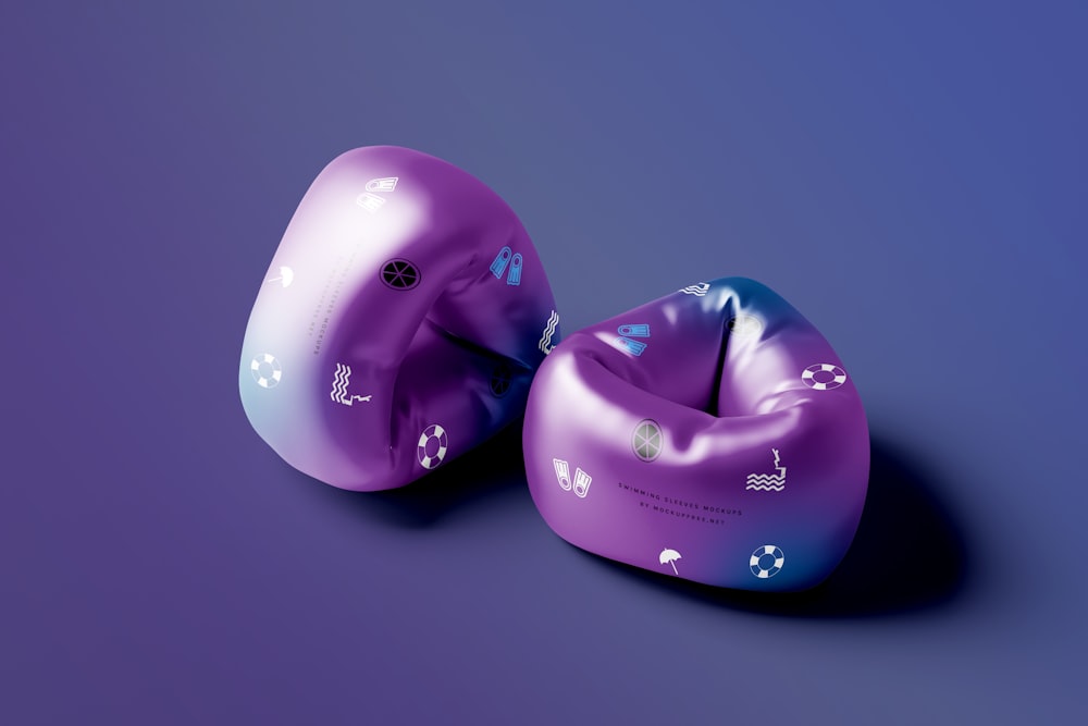 two inflatable objects on a blue and purple background