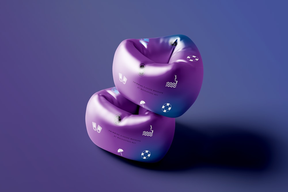 two purple inflatable objects on a purple background