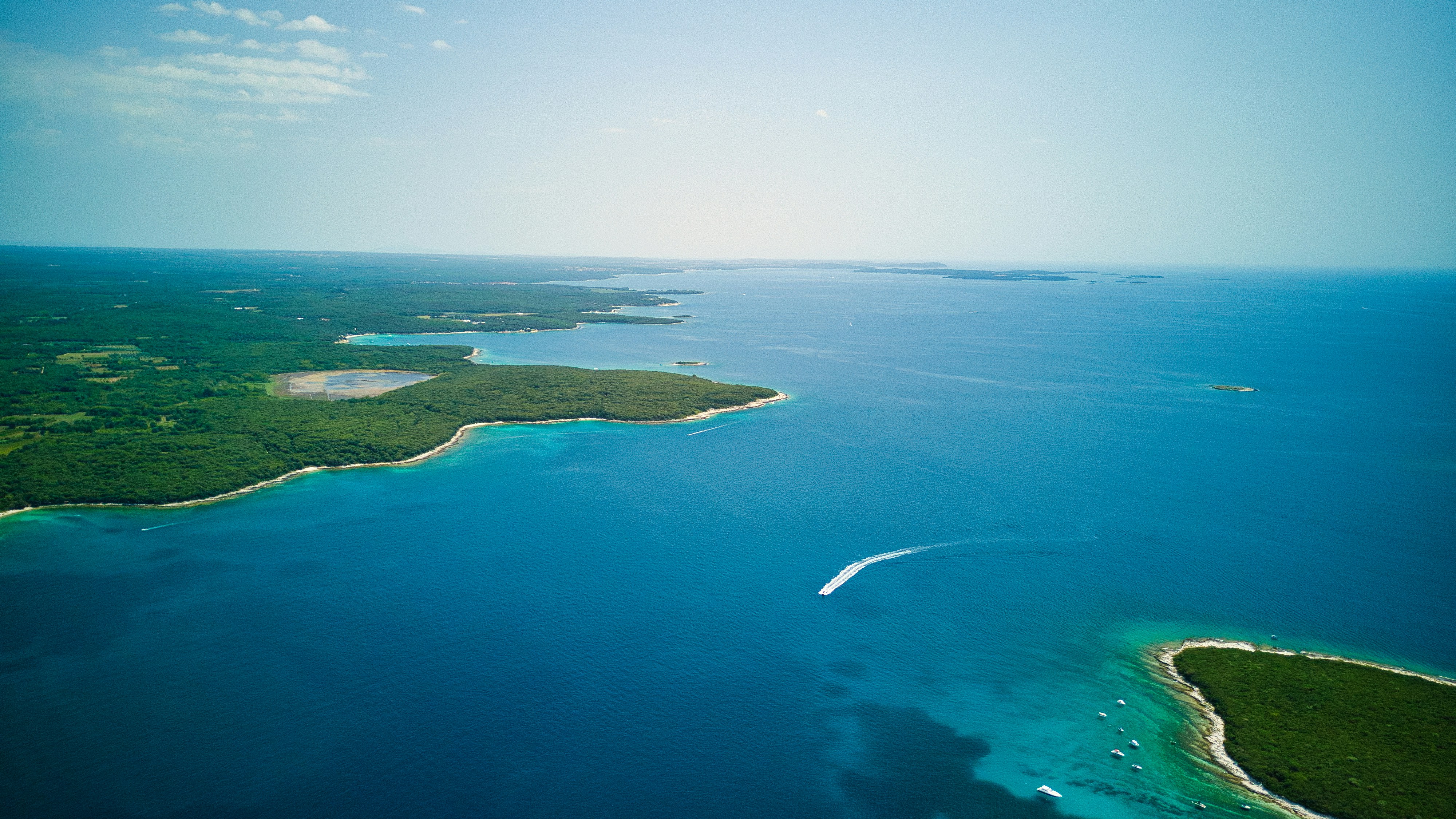 an aerial view of an island in the middle of the ocean
