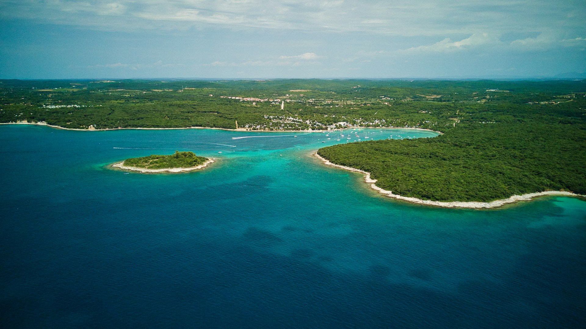 an aerial view of an island in the middle of the ocean