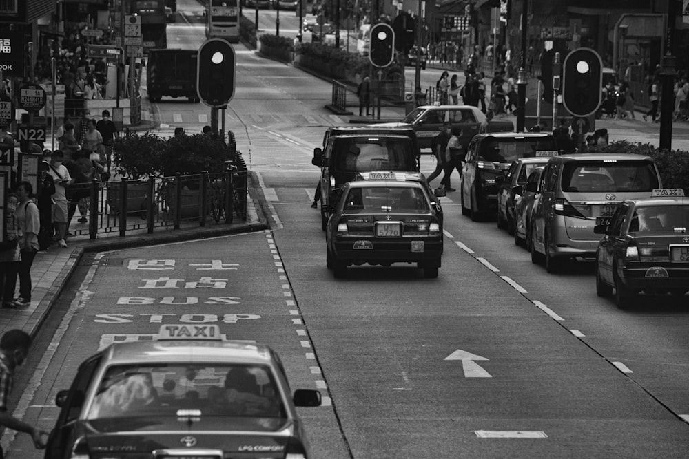 a black and white photo of a busy street