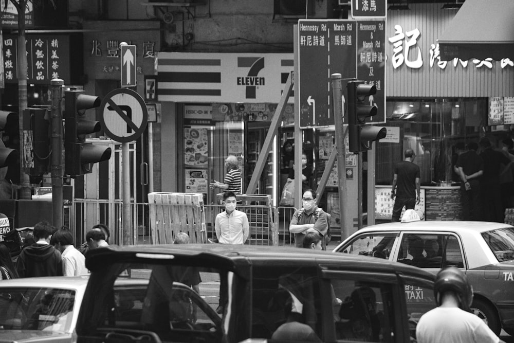 a black and white photo of a busy city street