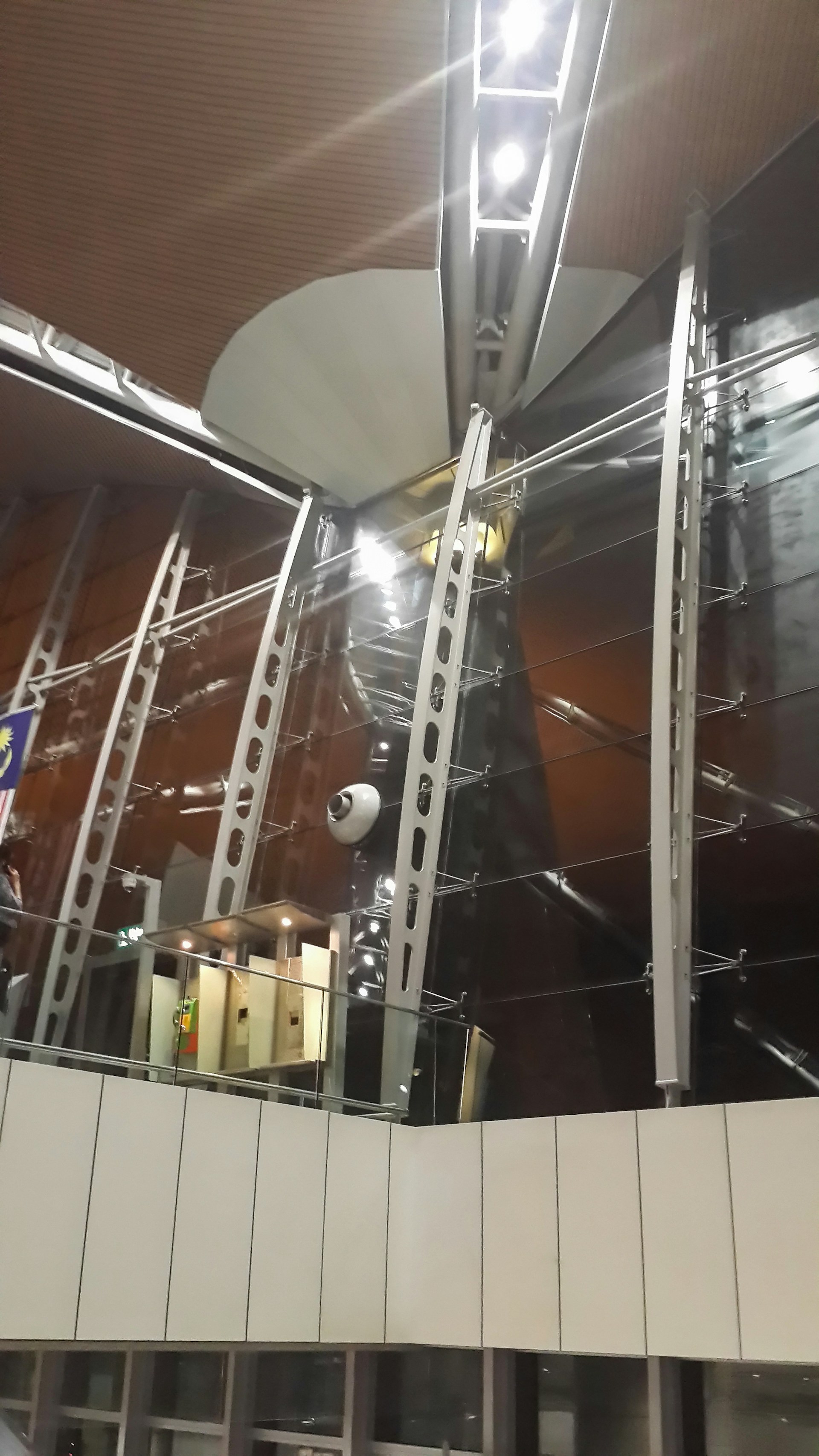 A sleek industrial warehouse with visible structural steel beams and modern lighting, showcasing precise engineering and clean design.