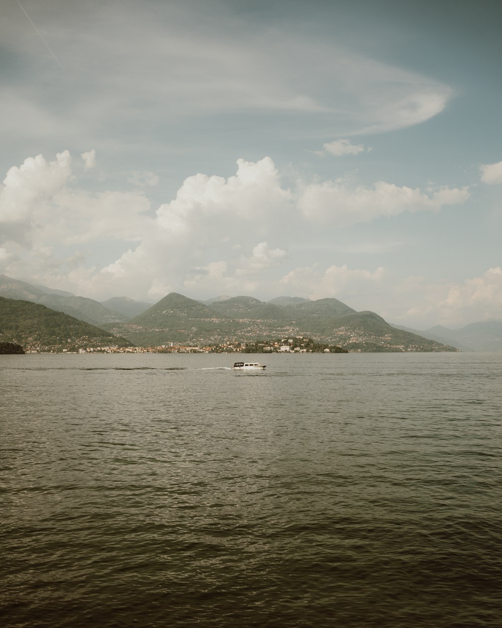 a large body of water with a boat in it