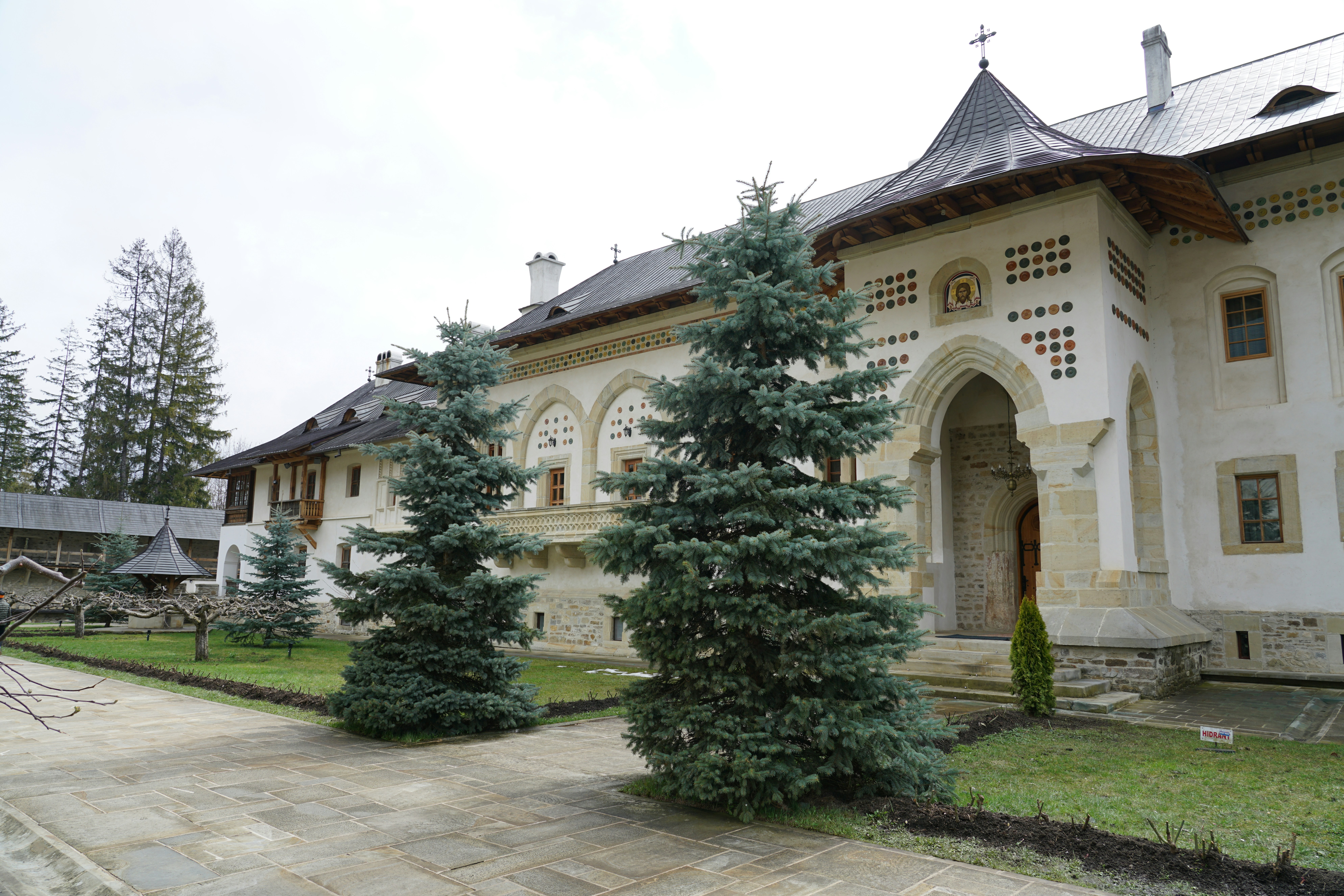 a building with a lot of trees in front of it