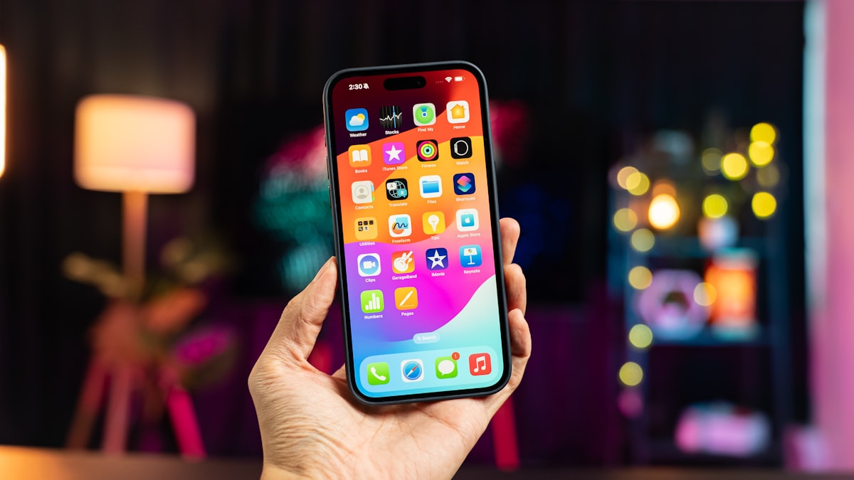 Hand holding an iPhone
