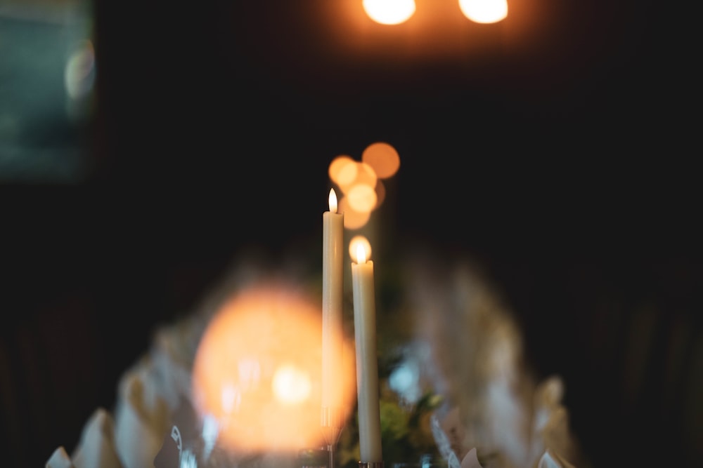 a close up of a table with candles on it