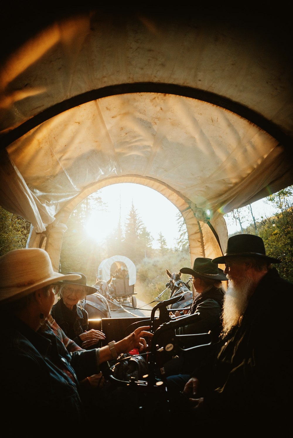 a group of men riding motorcycles down a road