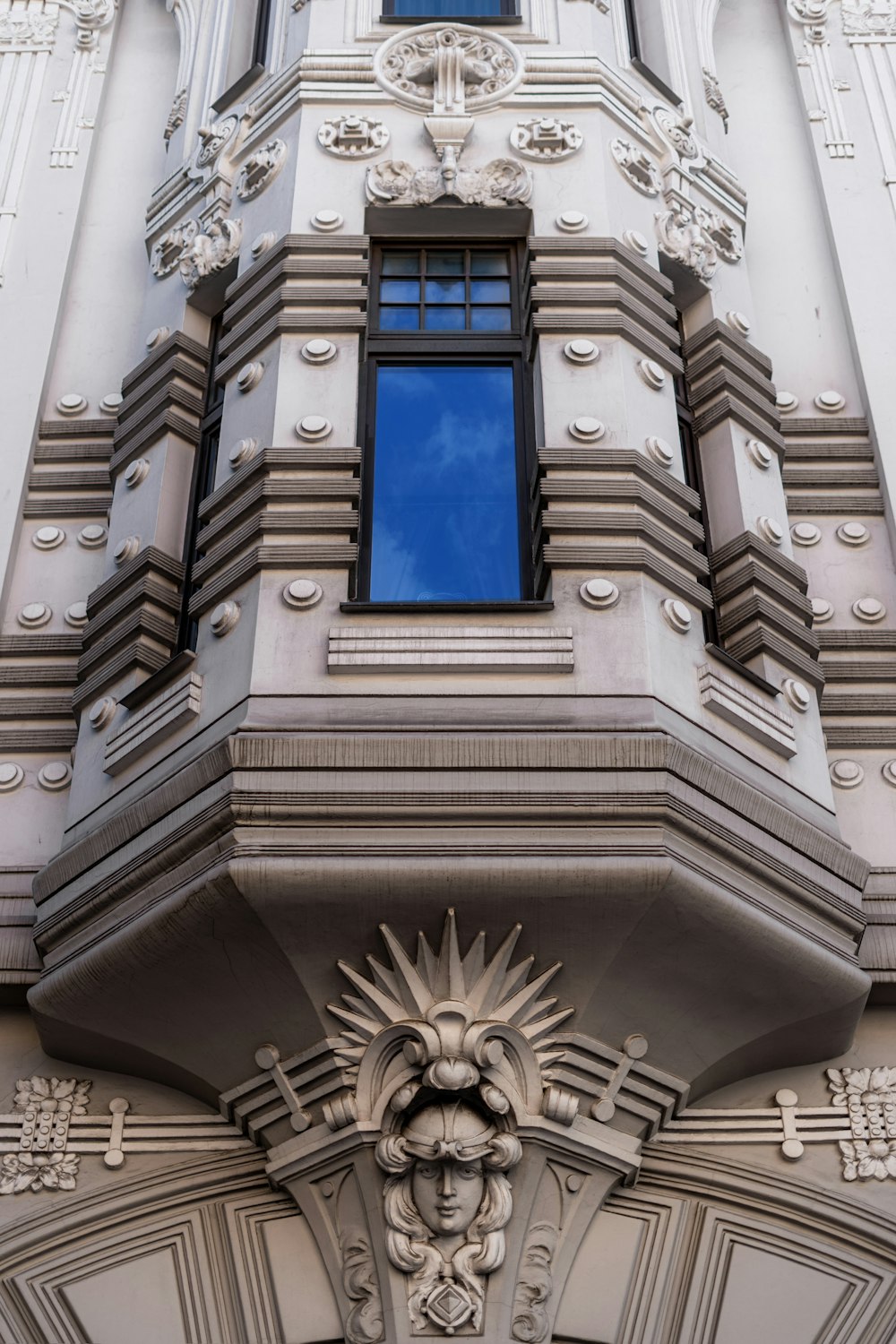 a tall building with a clock on the front of it