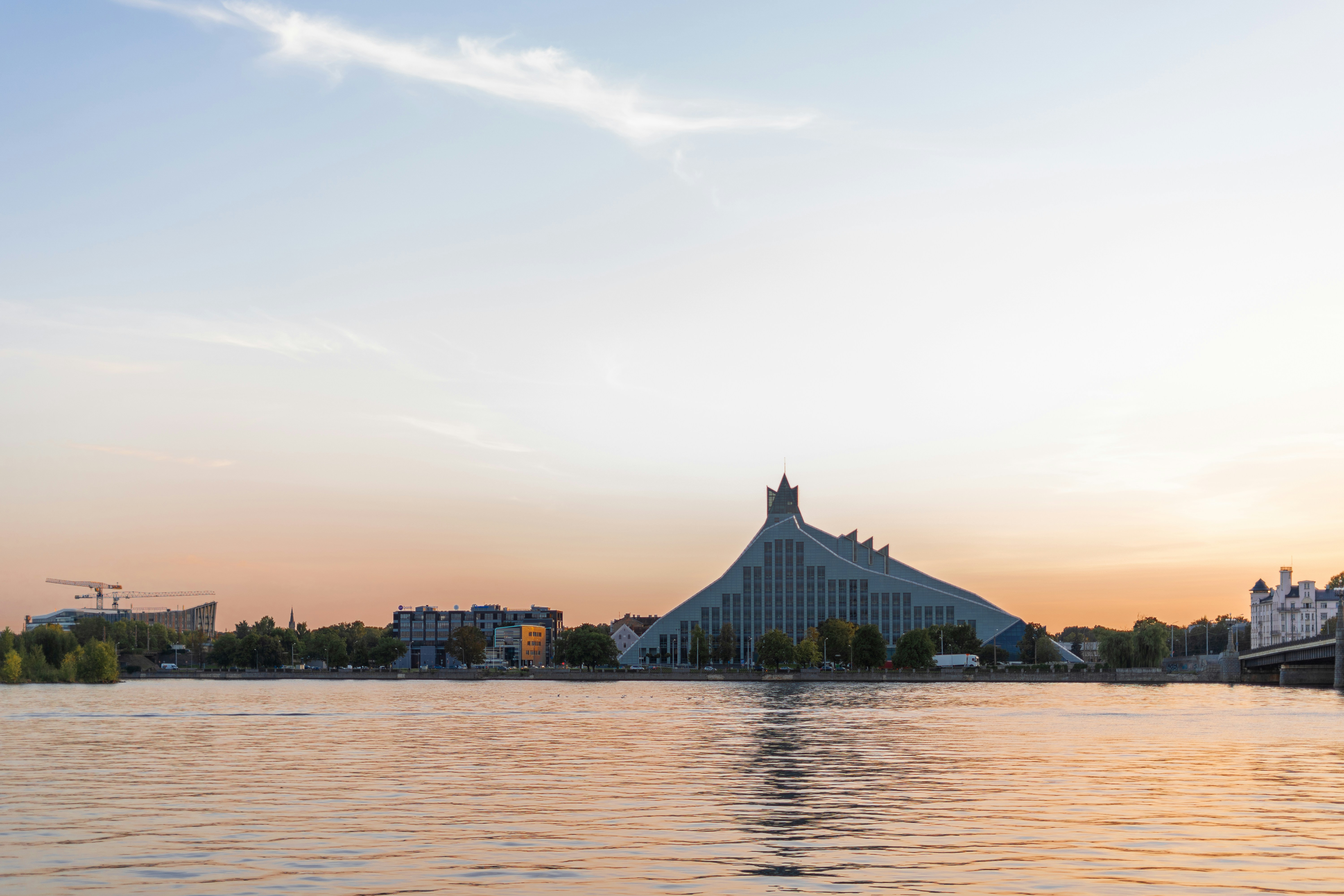 a body of water with a bridge in the background, 