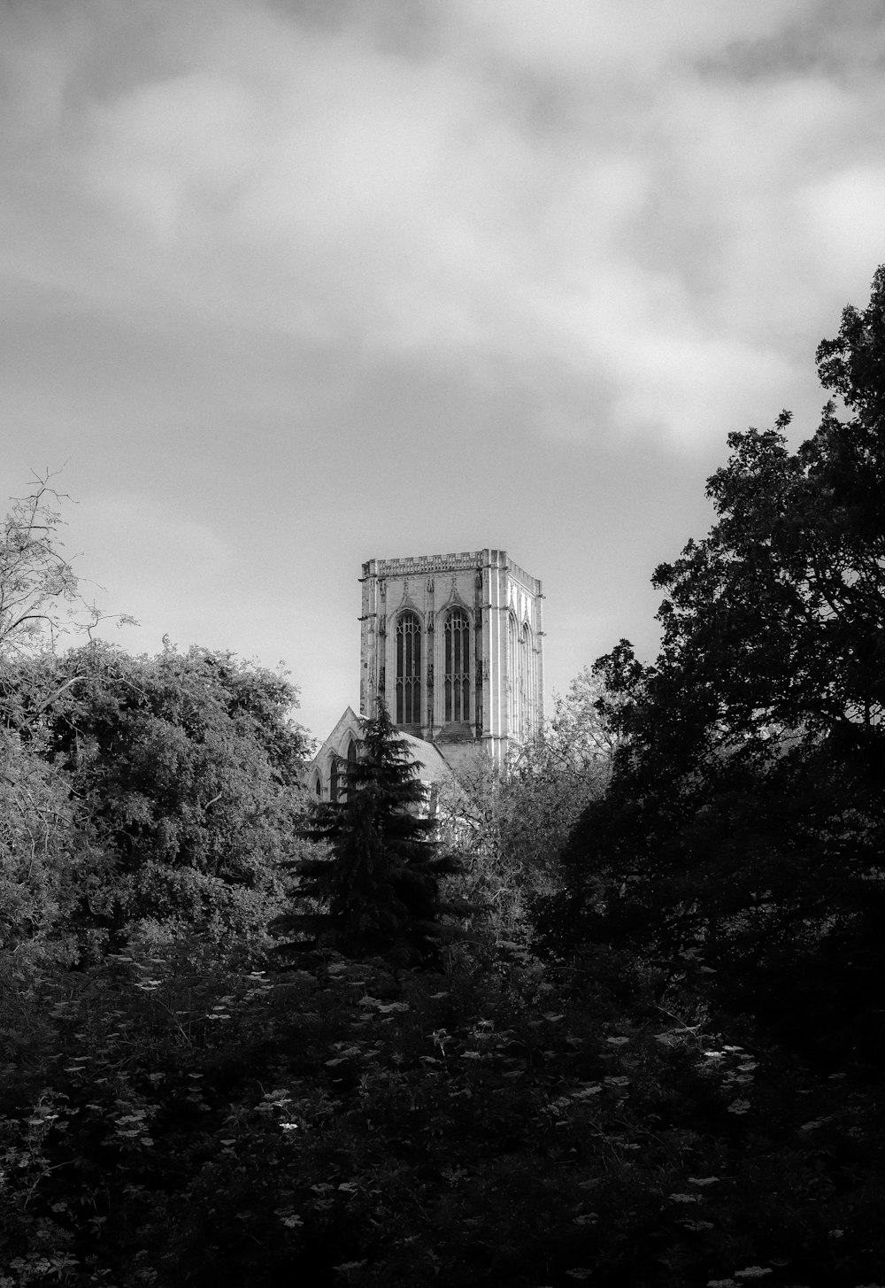 a black and white photo of a church tower