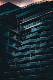 a tall building with balconies on the side of it