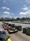 A wide shot of the kart track with colorful flags and event decorations.