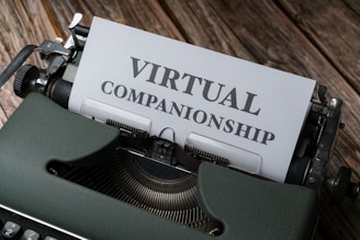 An old-fashioned typewriter with the words 'Virtual Companionship' typed on a sheet of paper. The image includes a green typewriter and a wooden surface background.