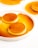 A close-up of a creamy pudding topped with caramel sauce.