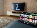 A sleek living room featuring a mounted high-gain satellite dish and a bein sports receiver glowing softly on a modern media console