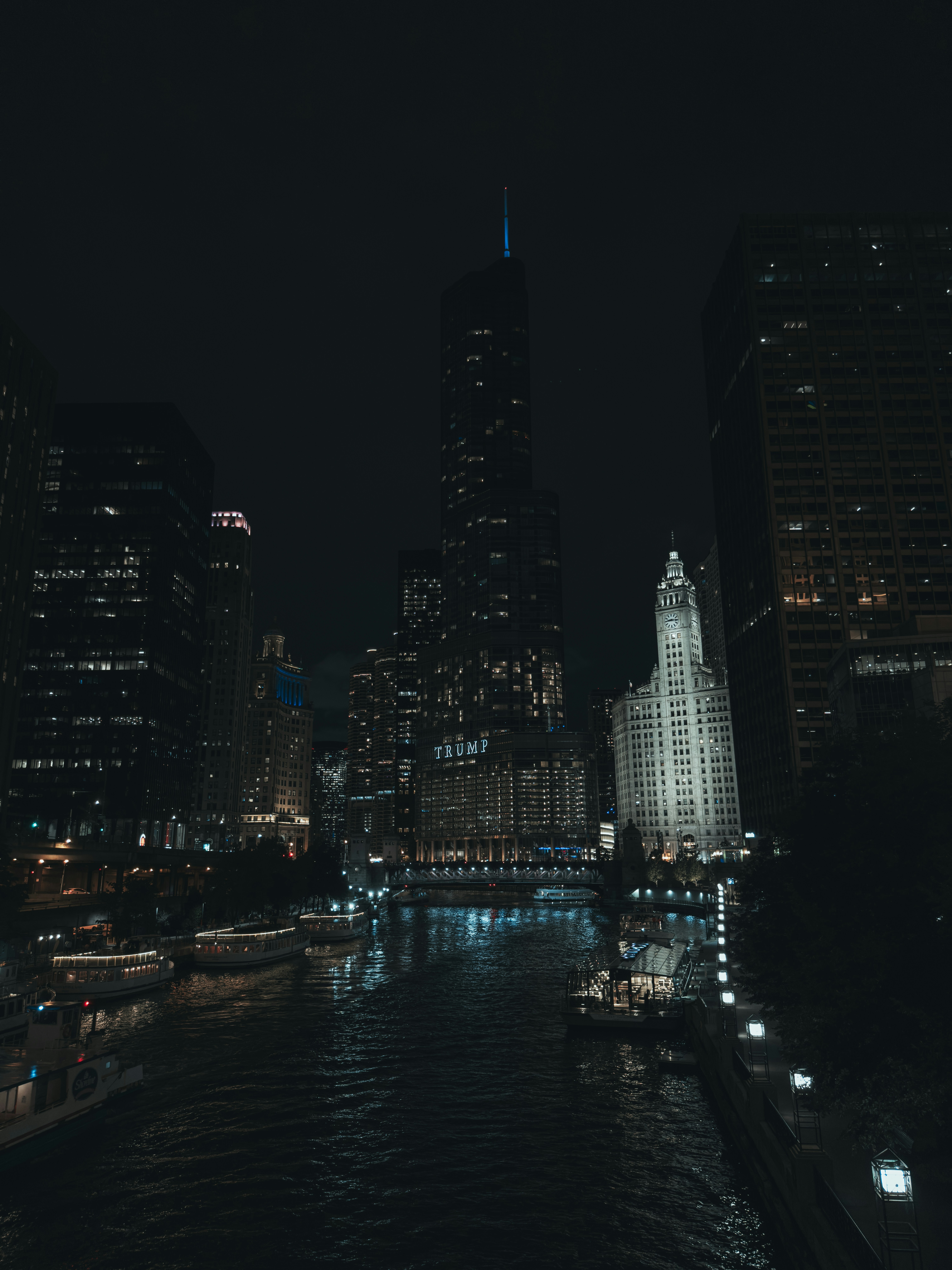 a city at night with a river running through it