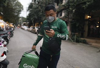 Frontline worker checking mobile for orders