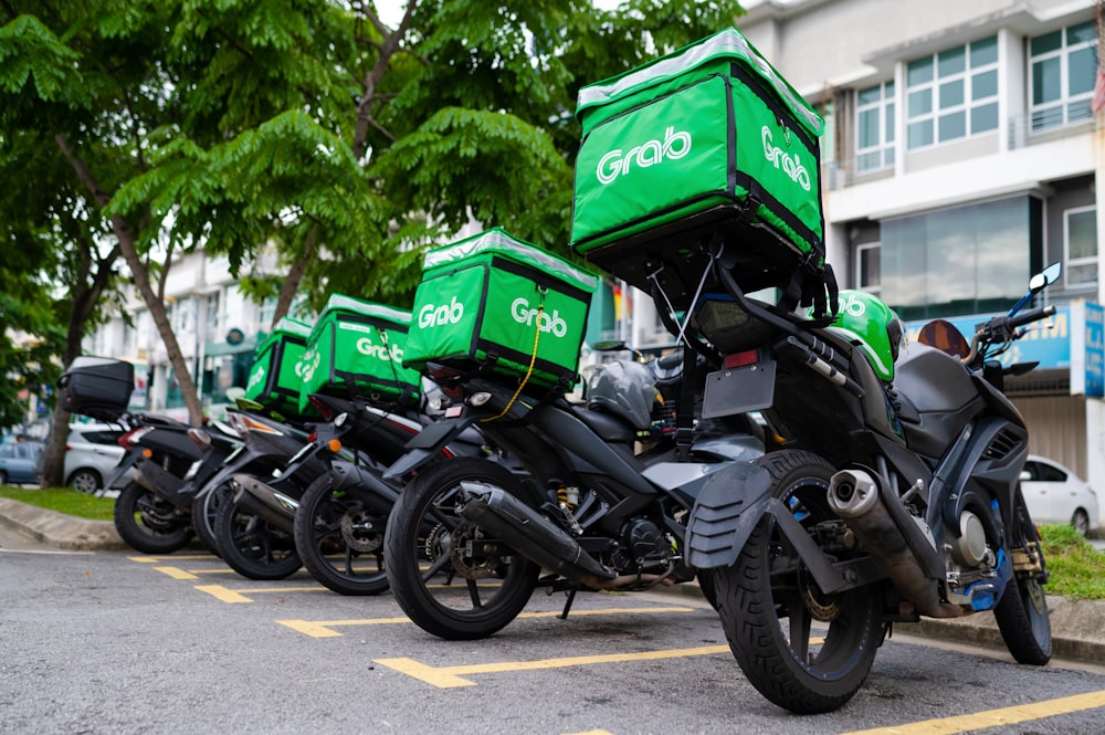 a row of parked motorcycles with boxes on them
