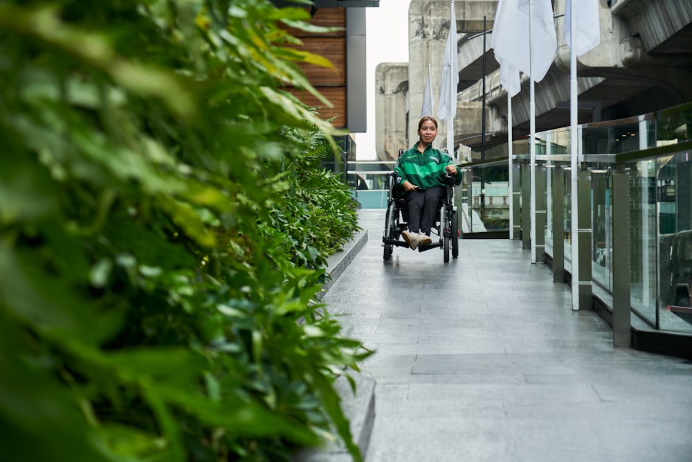 a person in a wheel chair on a walkway