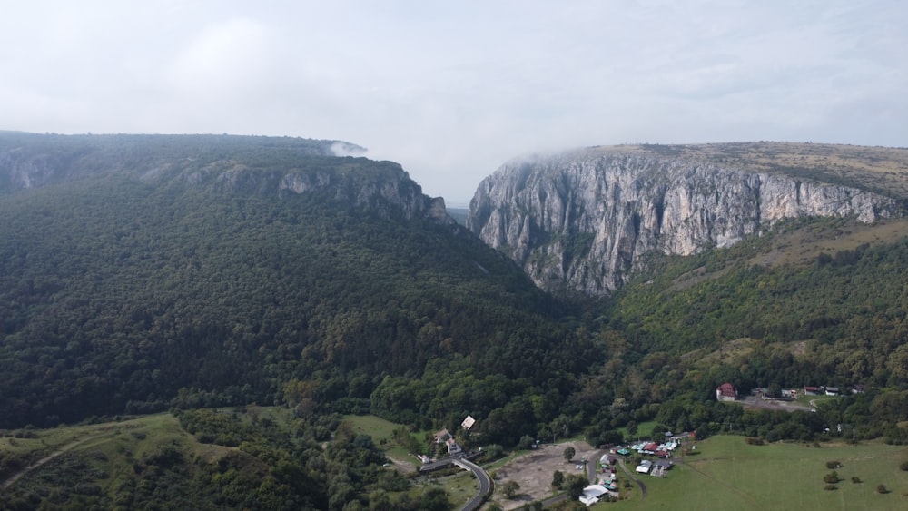 a view of a valley with a mountain in the background